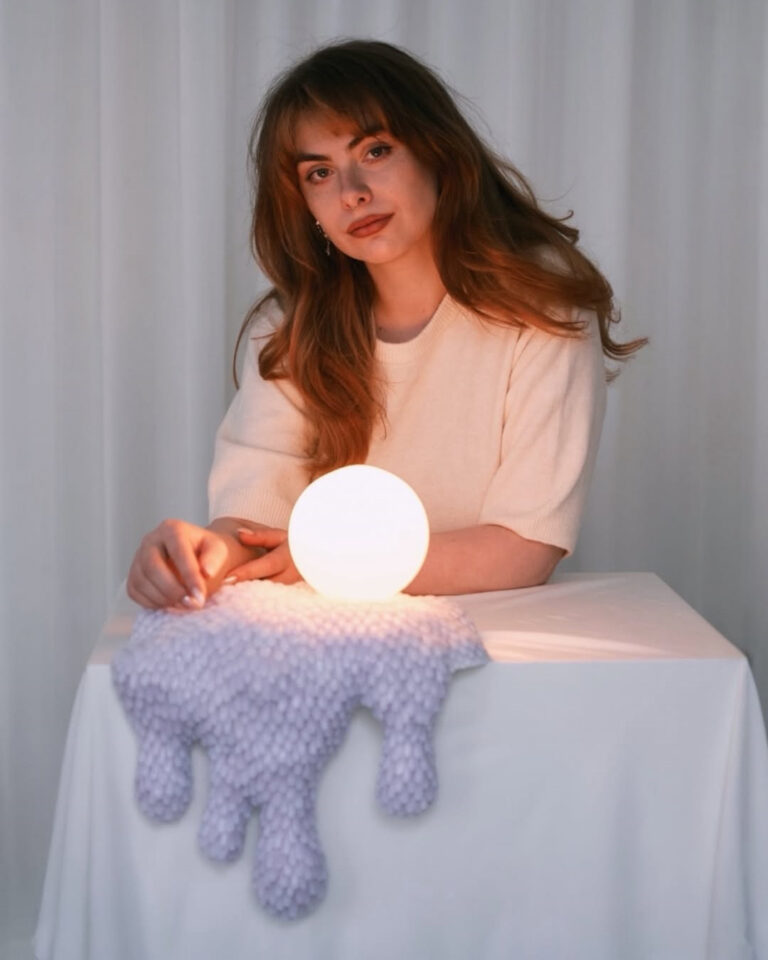 Gabriela Słomińska of BINIA Studio with a sculptural lamp