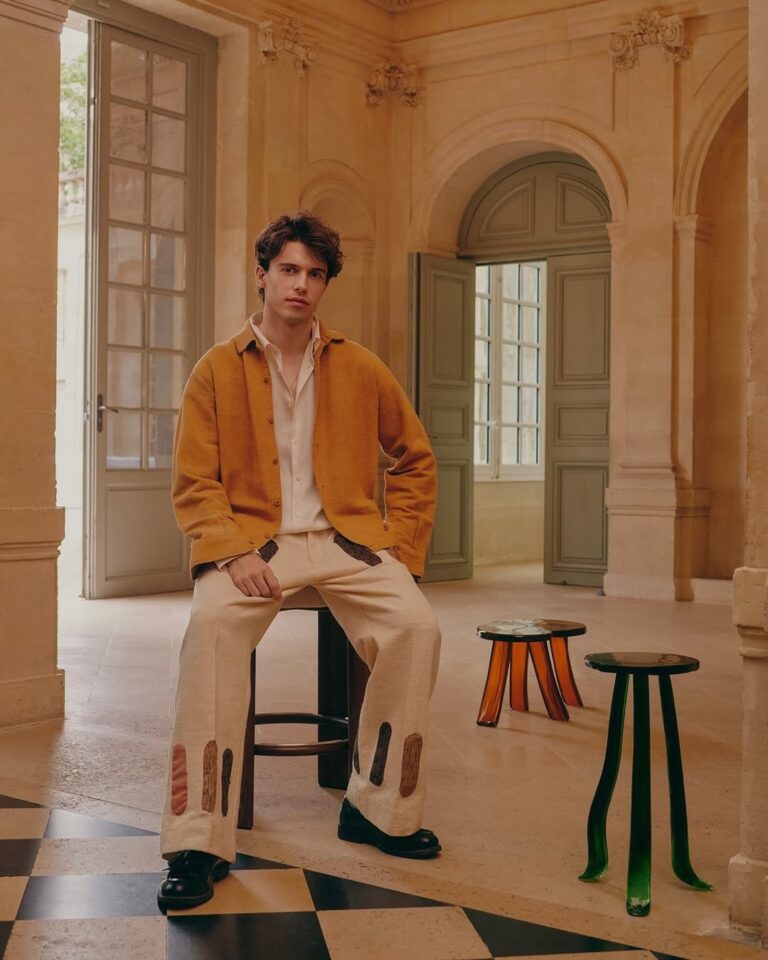 Designer Szymon Keller with his collectible furniture